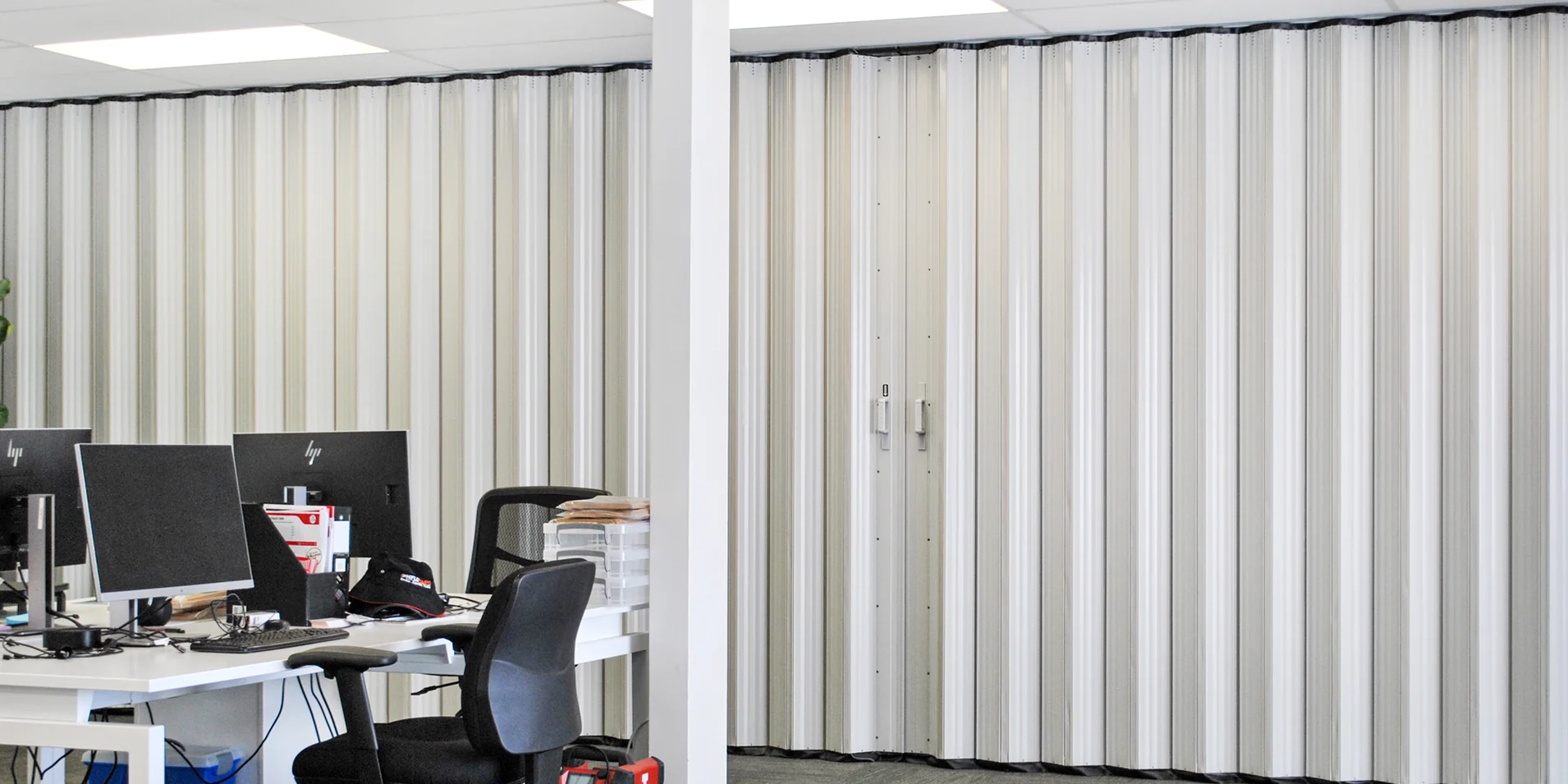 DuraSound acoustic accordion partition dividing open plan office workspaces