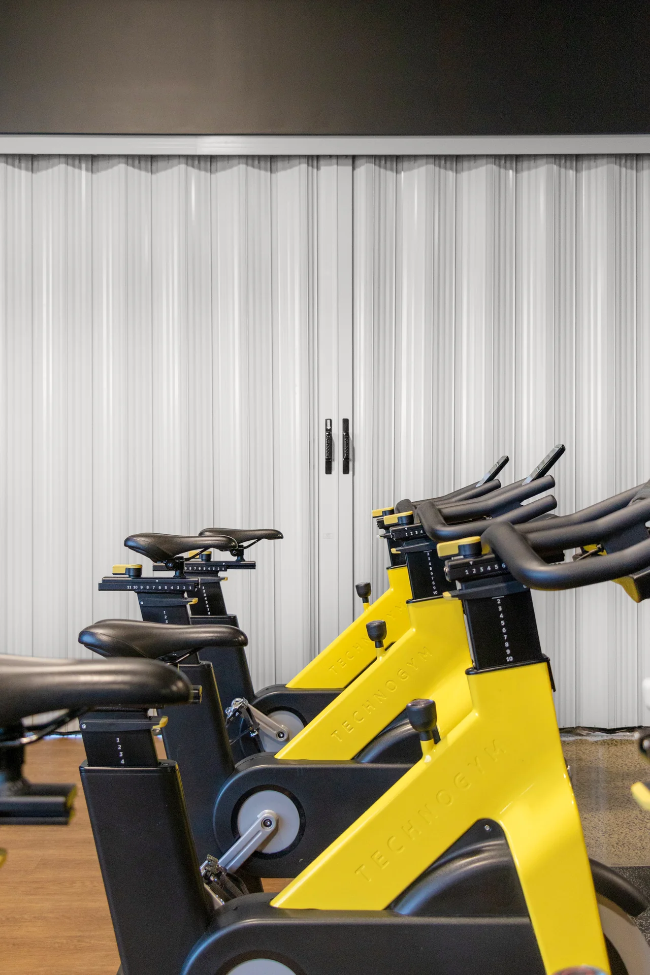DuraFlex accordion partition dividing a gym space to create flexible workout areas