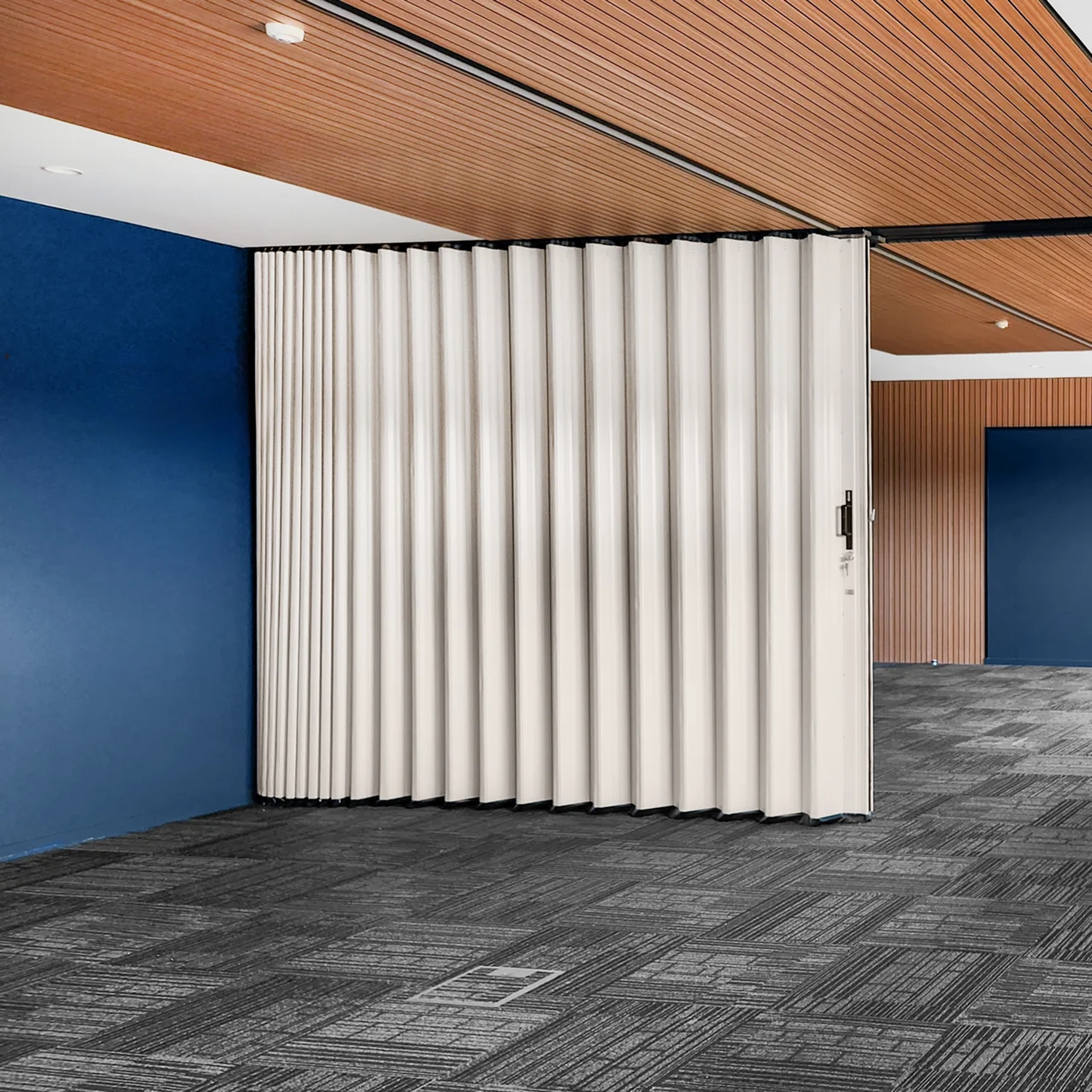DuraFlex accordion partition dividing a meeting room to create flexible workspace areas