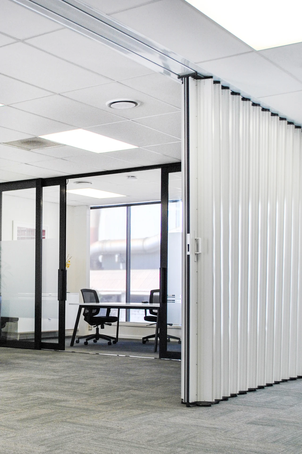 DuraSound acoustic accordion partition dividing open plan office workspaces