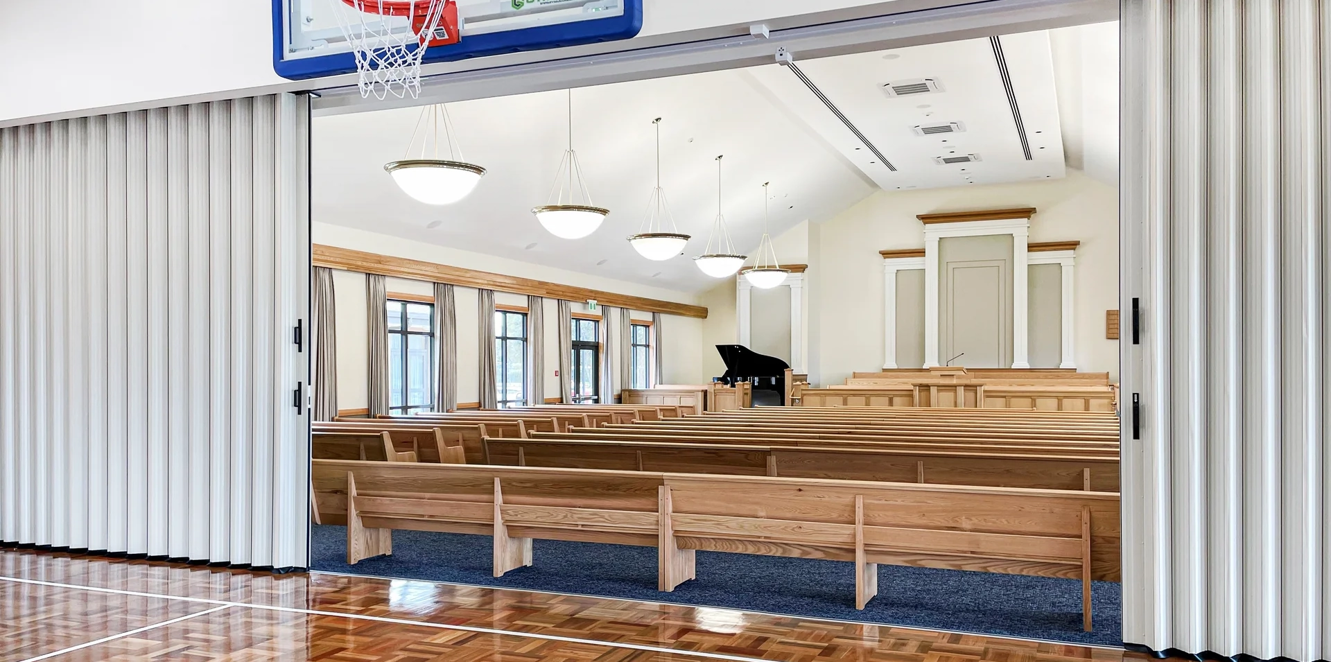 DuraSound acoustic accordion partition dividing a church hall and worship space