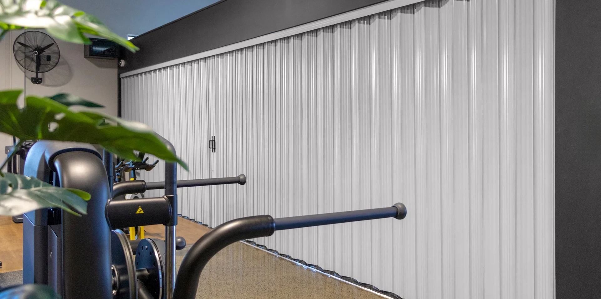 DuraFlex accordion partition dividing a gym space to create flexible training areas