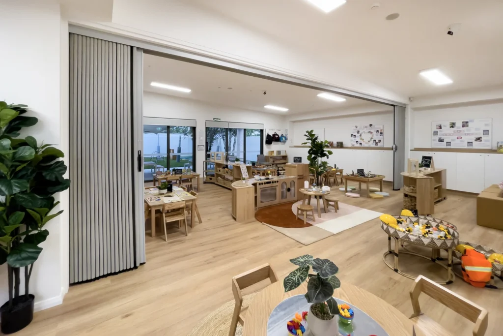 DuraFlex accordion partition in an early childcare centre creating flexible classroom and play spaces