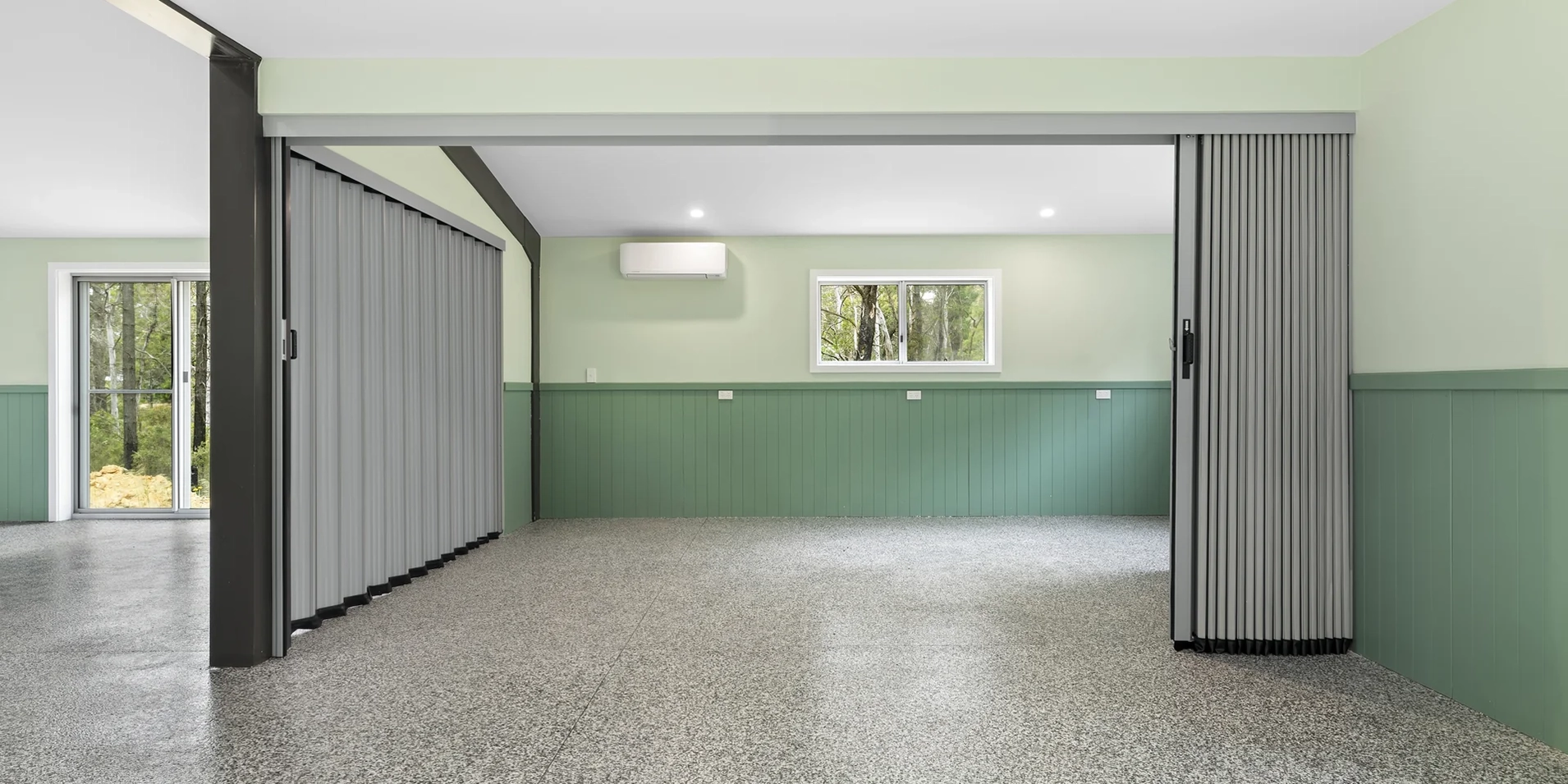 DuraFlex accordion partitions stacked to side in large community hall