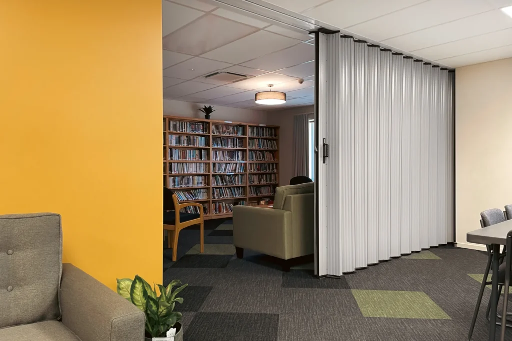 DuraSound acoustic accordion partition dividing a meeting room and breakout space